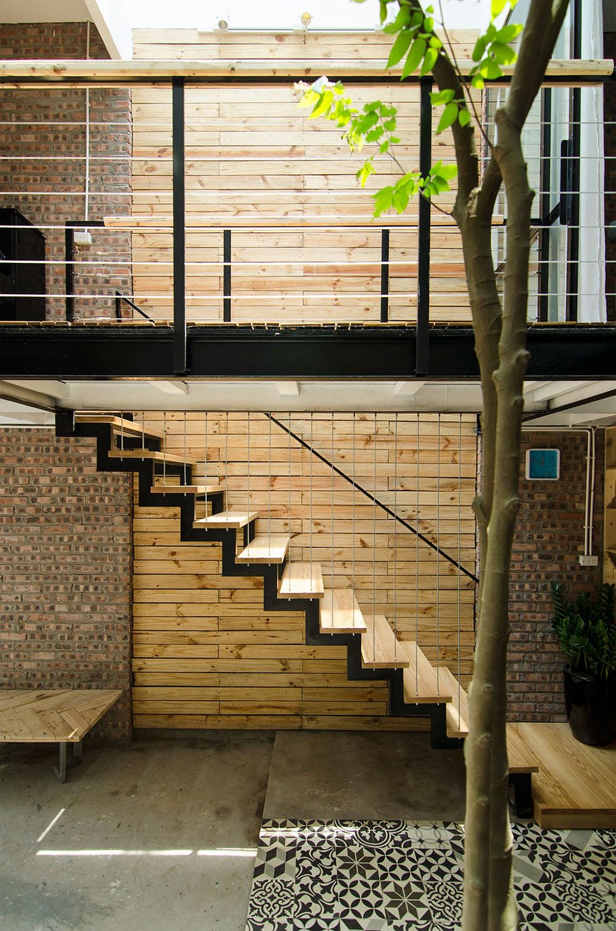 Wood and brick surfaces add textural beauty to the small interior