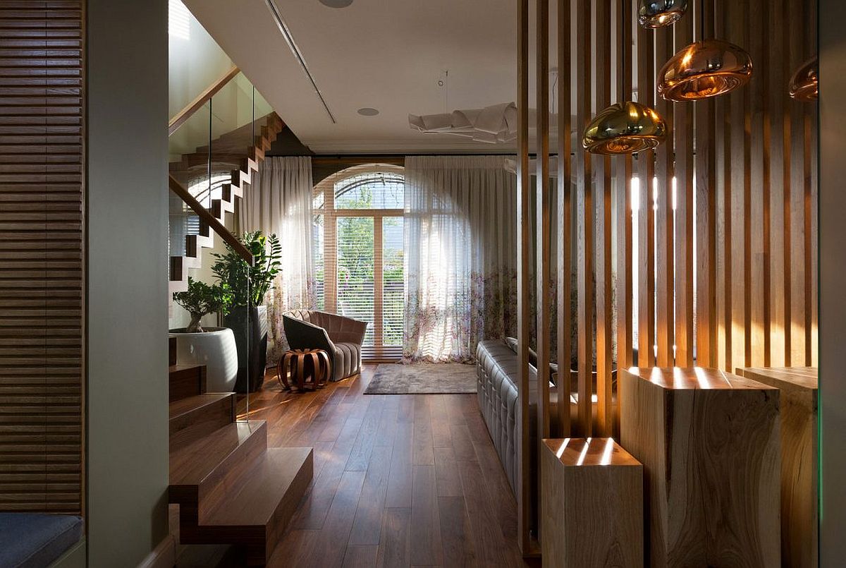 Wooden slats filter in sunlight even while creating a private living space