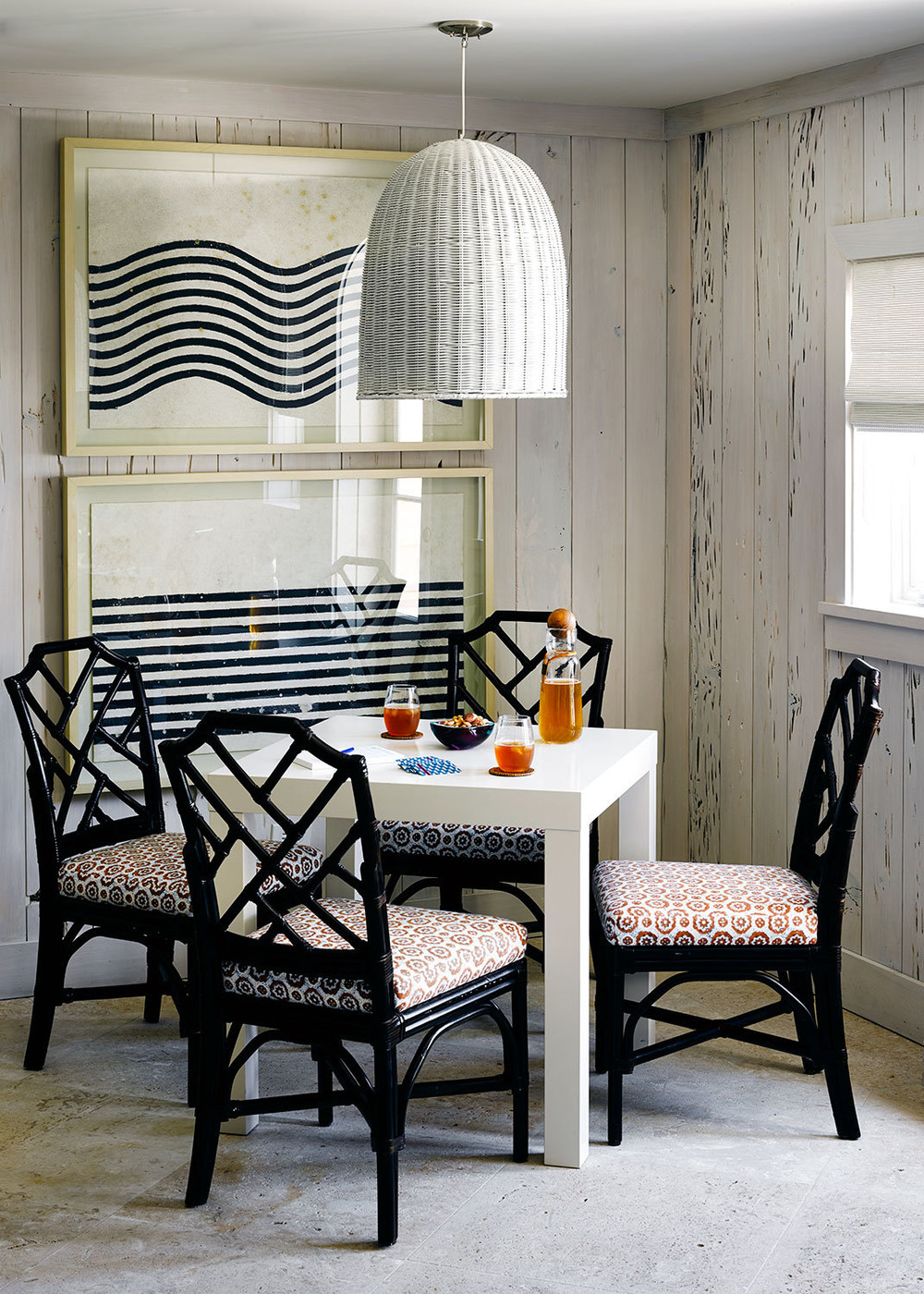 Woven lighting over a corner eating nook