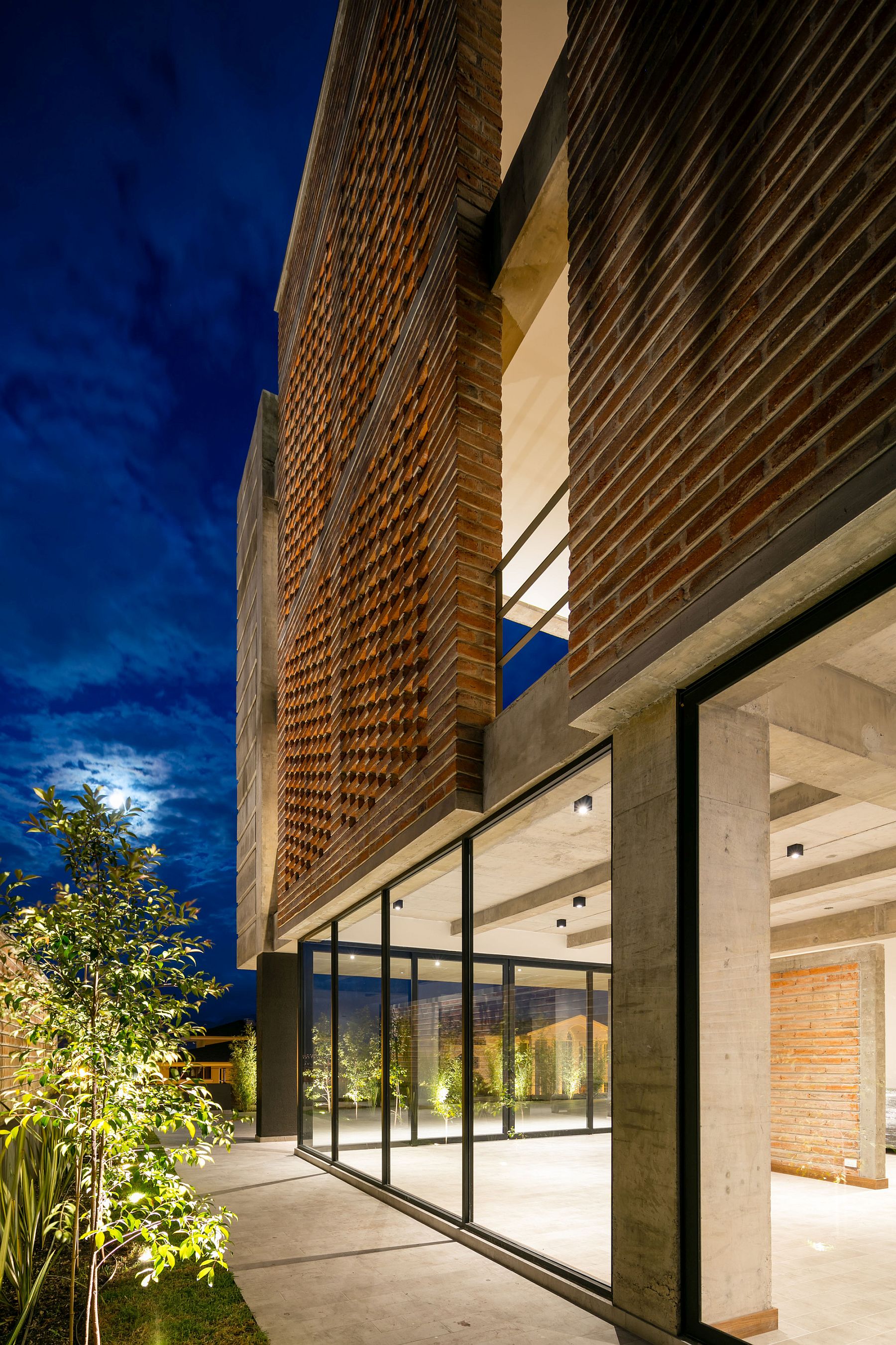 A Green Façade: Distinct Double-Story Porch Greets You at Zambeze