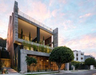 A Green Façade: Distinct Double-Story Porch Greets You at Zambeze