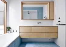 Beautiful-blue-tiles-energize-the-contemporary-bathroom-in-white-217x155