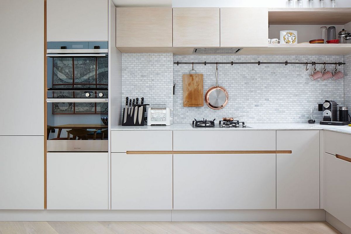 Beautiful tiled backsplash for the small kitchen in white with smart white cabinets