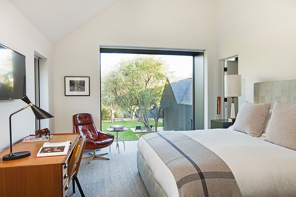 Bedroom with simple workspace and lovely views