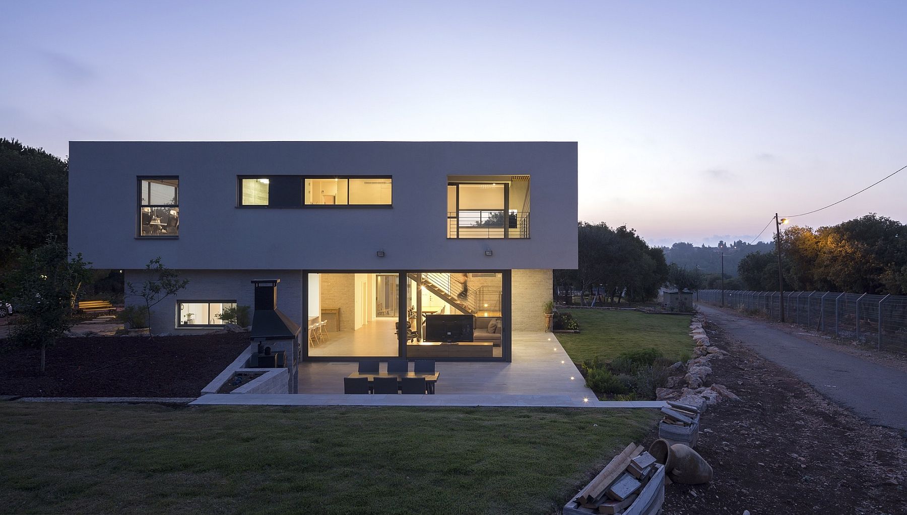 Cantilevered top section of the house gives it a cool sculptural vibe