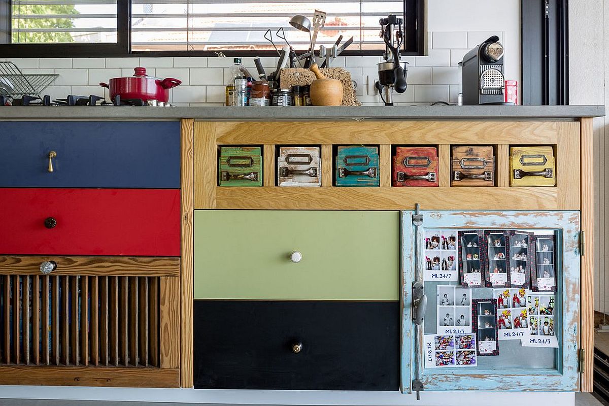 Colorful wooden cabinets in the kitchen bring cheerful allure