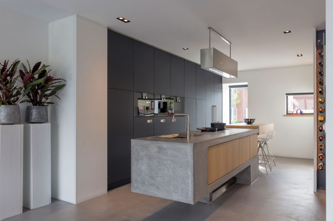 Contemporary kitchen with concrete kitchen island