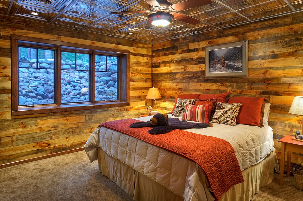 Cozy rustic bedroom clad in wood and metal