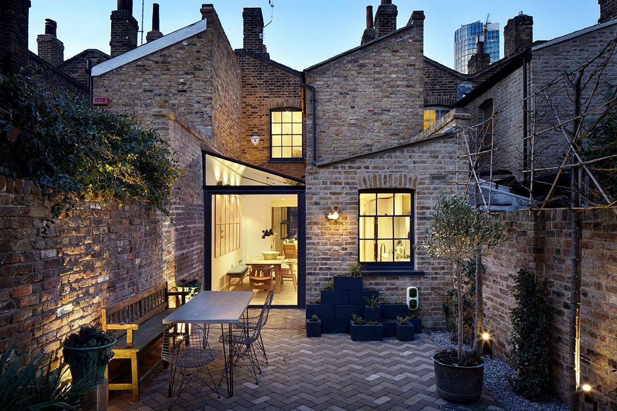 Elegant and non intrusive extension revitalizes traditional brick house in London