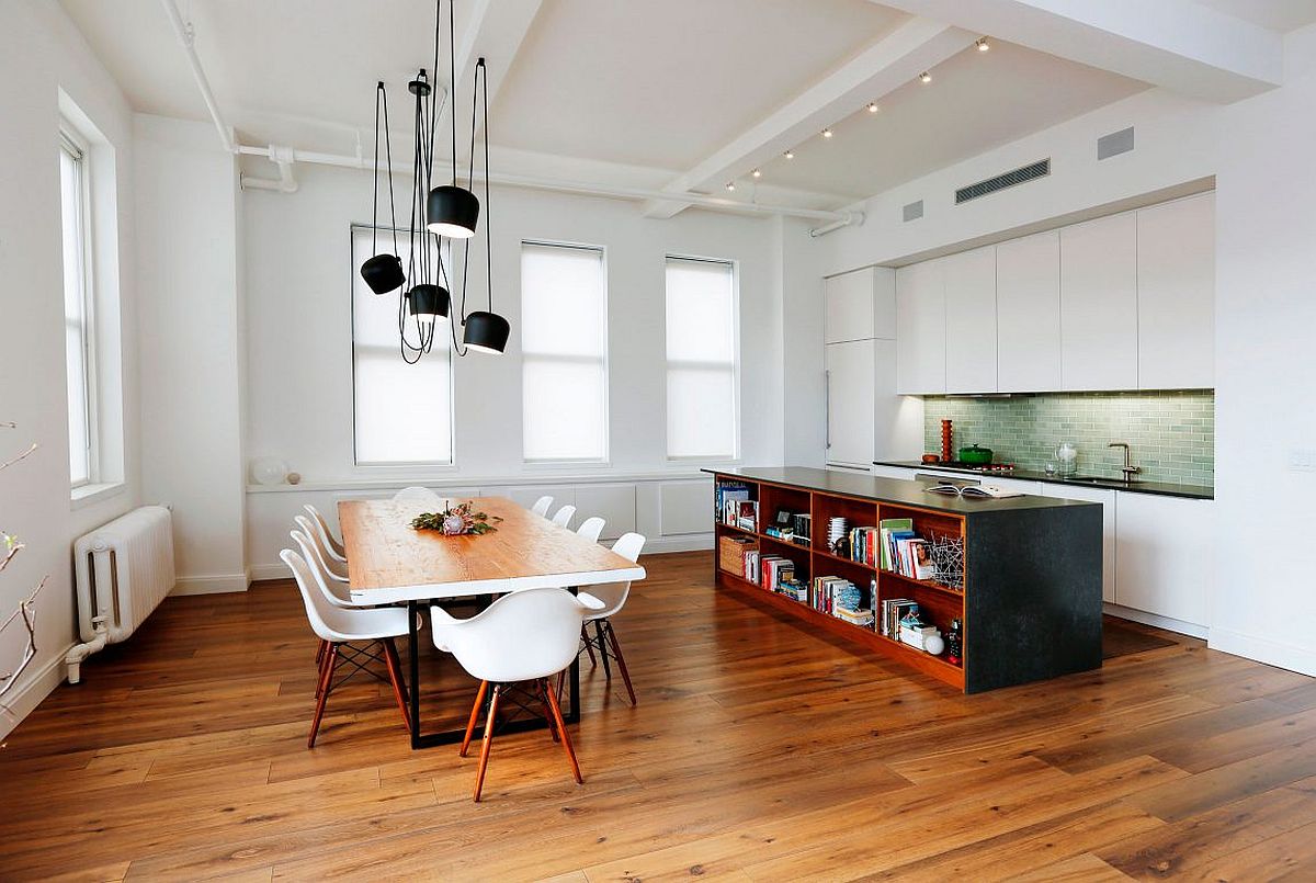 Elegant kitchen and dining area of the NYC apartment draped largely in white