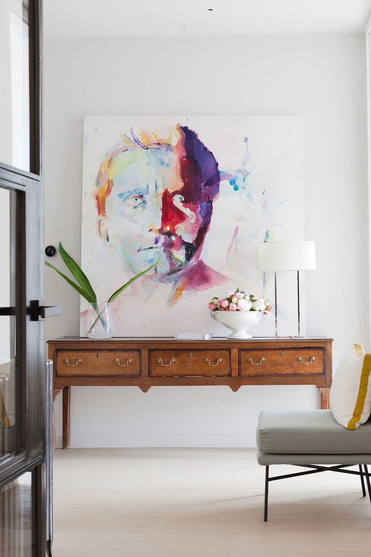 Entry console and art work inside the smart London penthouse with industrial style