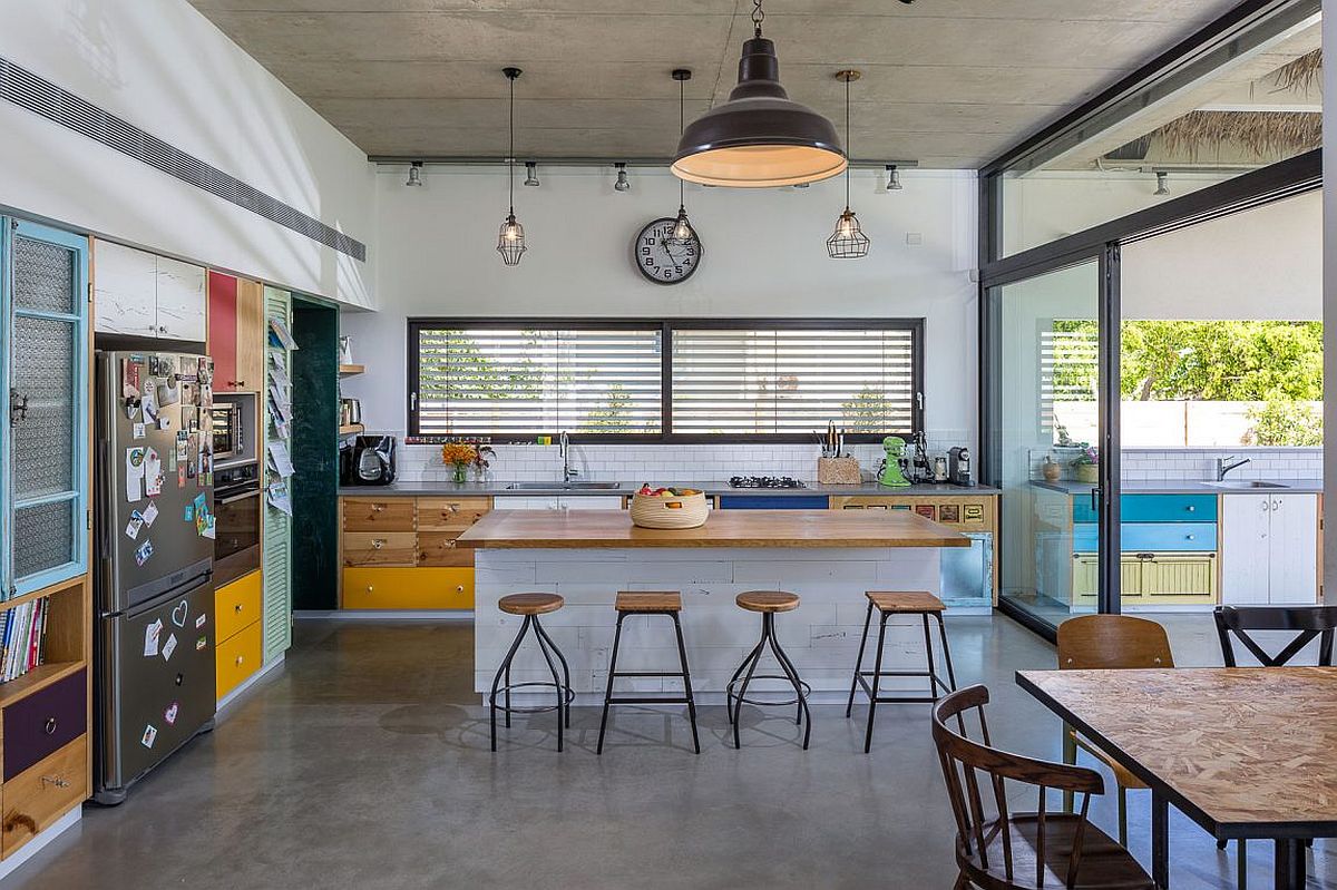 Exposed concrete floor and ceiling of the breezy family home in Hofit, Israel