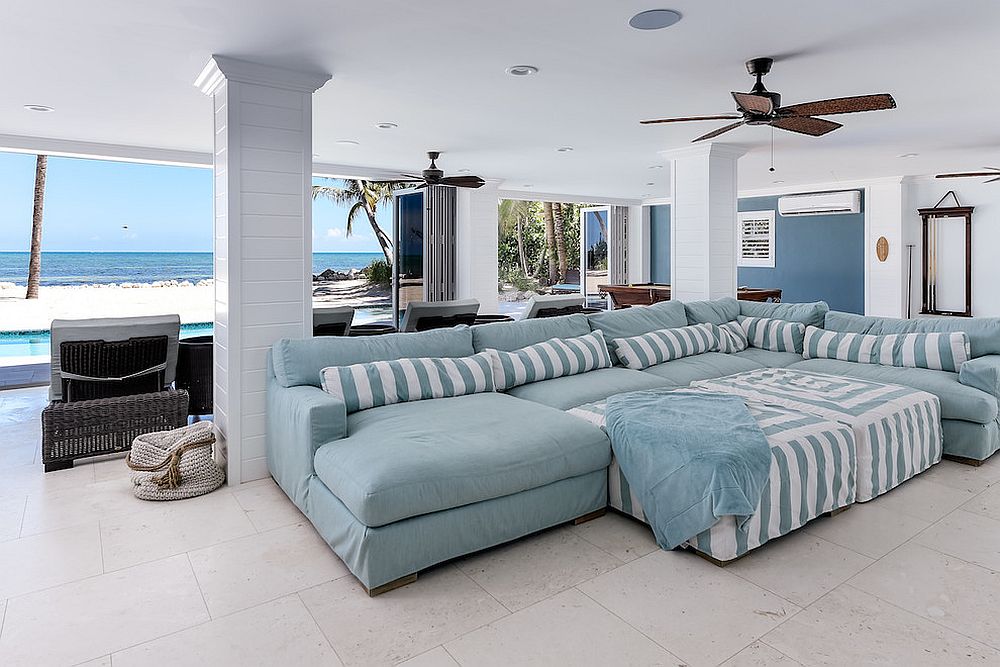 Exquisite beach style home theater with a view of the ocean outside [From: RTG Construction / Andy Frame Photography]