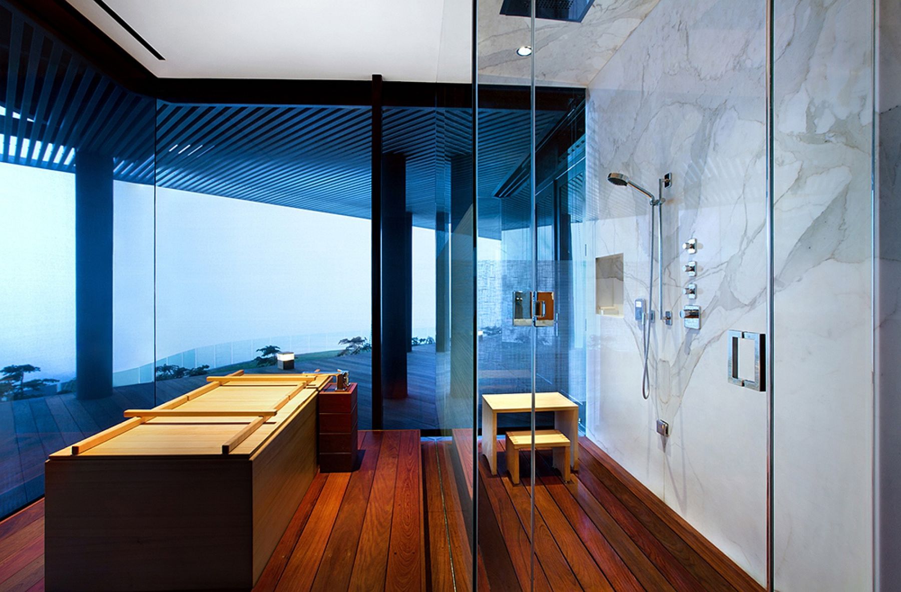 Exquisite contemporary bathroom with marble and glass shower area