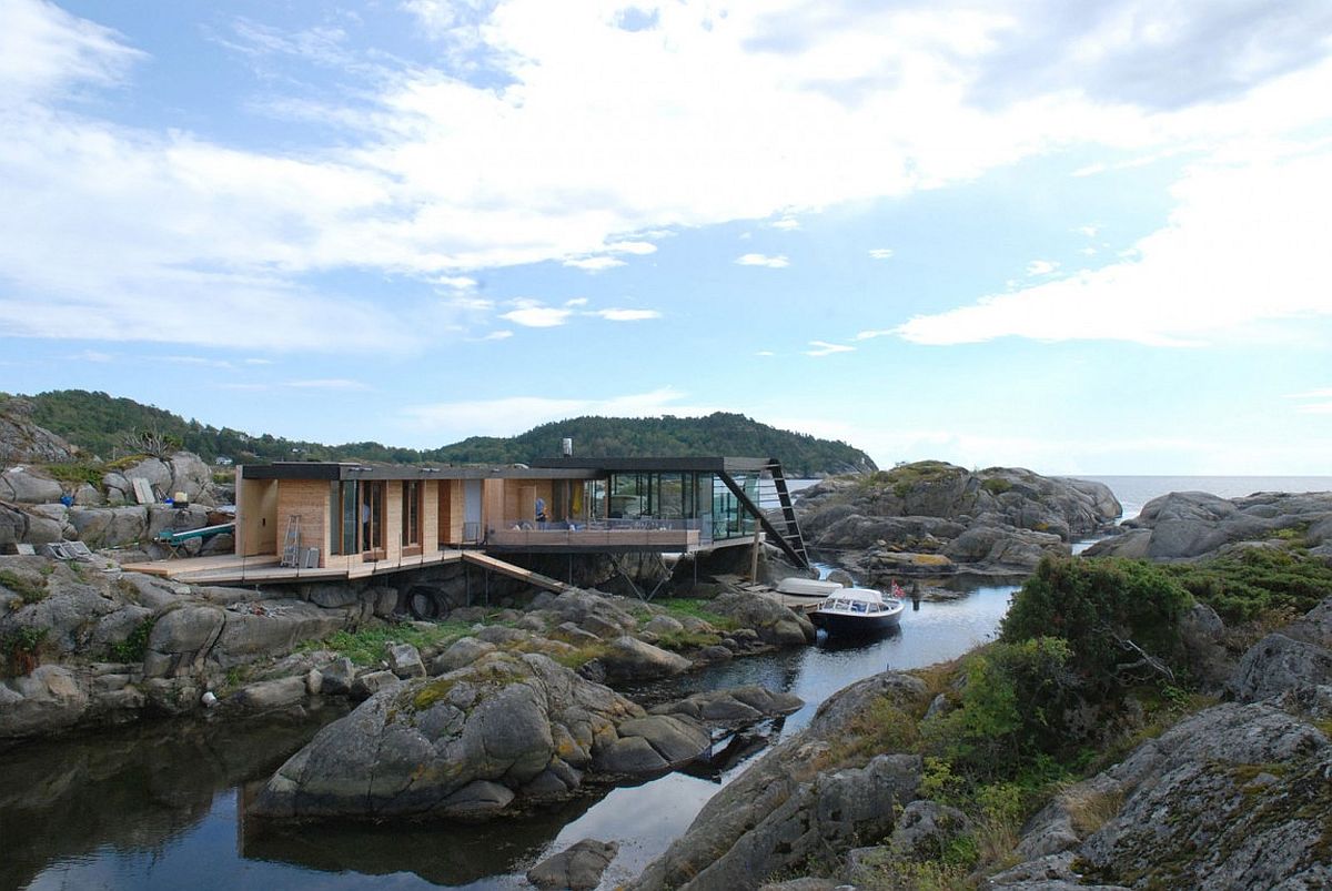 Exquisite holiday home built on an uneven rocky island above the water