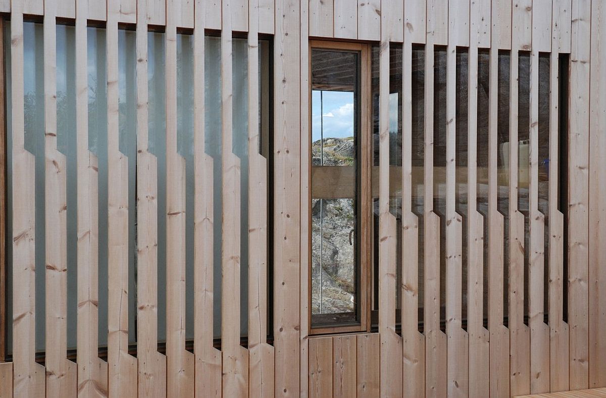 Exterior of the cabin draped in wood