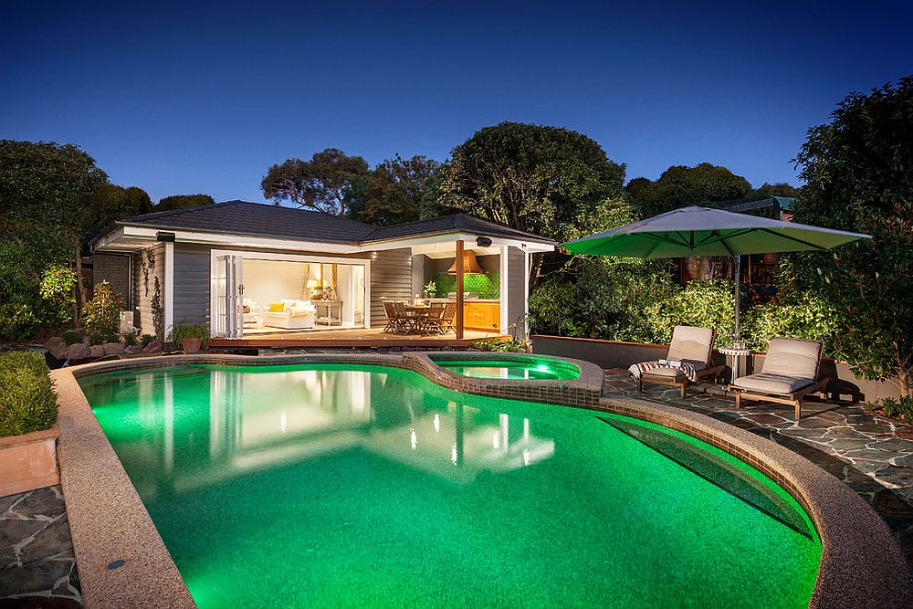 Fabulous pool house with al fresco dining and comfy seating for guests [Design: Acorn Garden Houses]