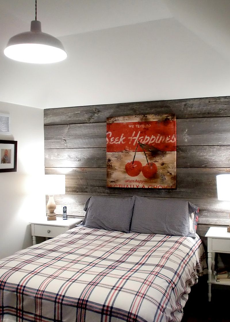 Farmhouse style bedroom with a modest reclaimed wood feature wall