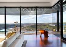 Floor-to-ceiling-glass-window-offer-a-stunning-view-of-Lake-Austin-and-the-rolling-hills-217x155