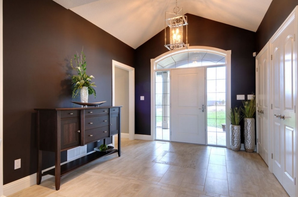 Foyer with a console table via Quality Construction Services