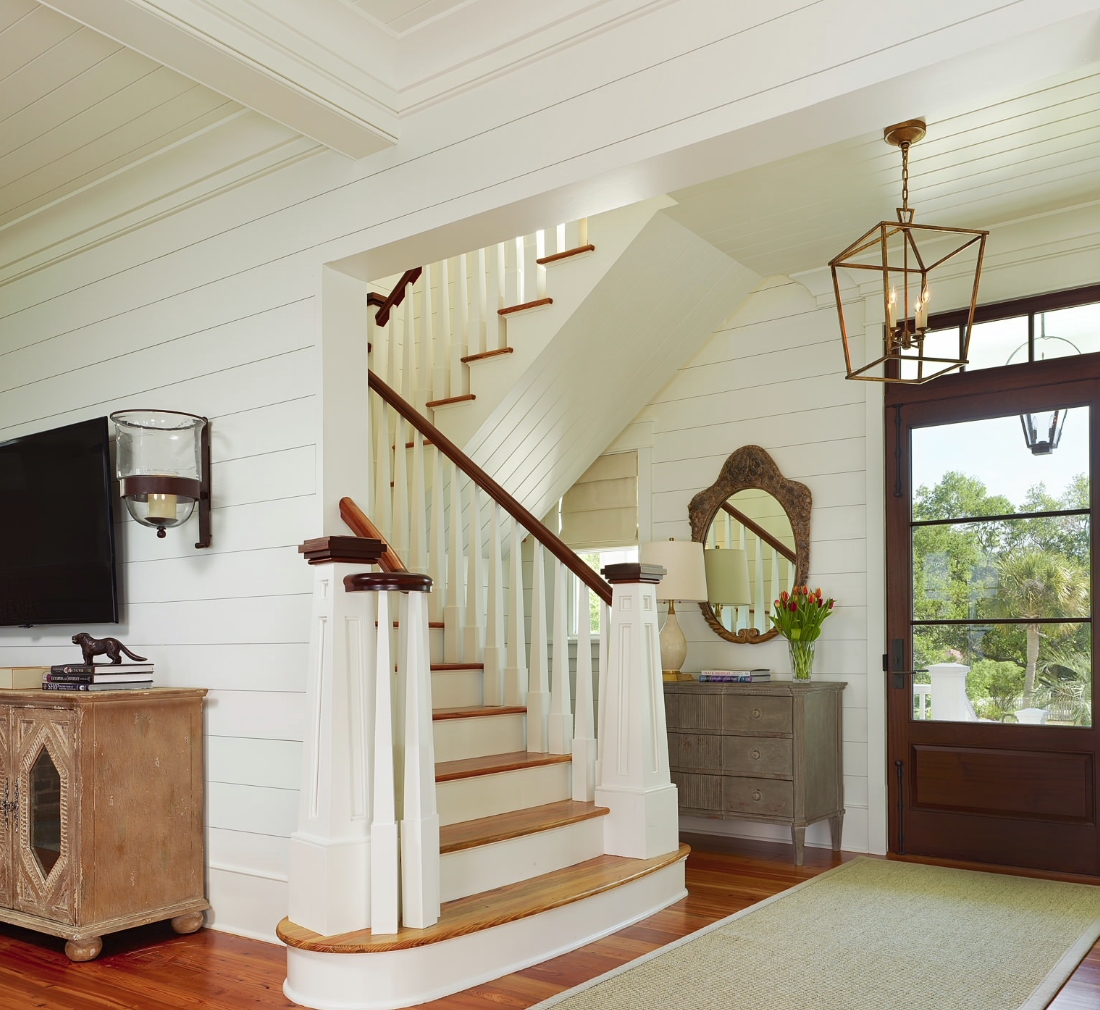 Foyer with a pendant light via Structures Building Company