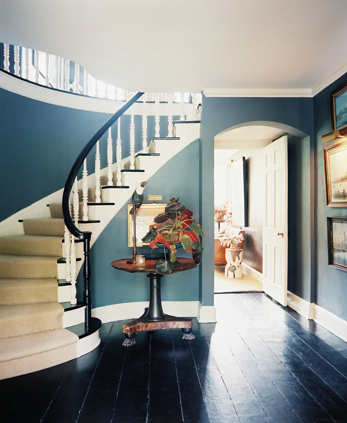Foyer with a staircase via Lonny