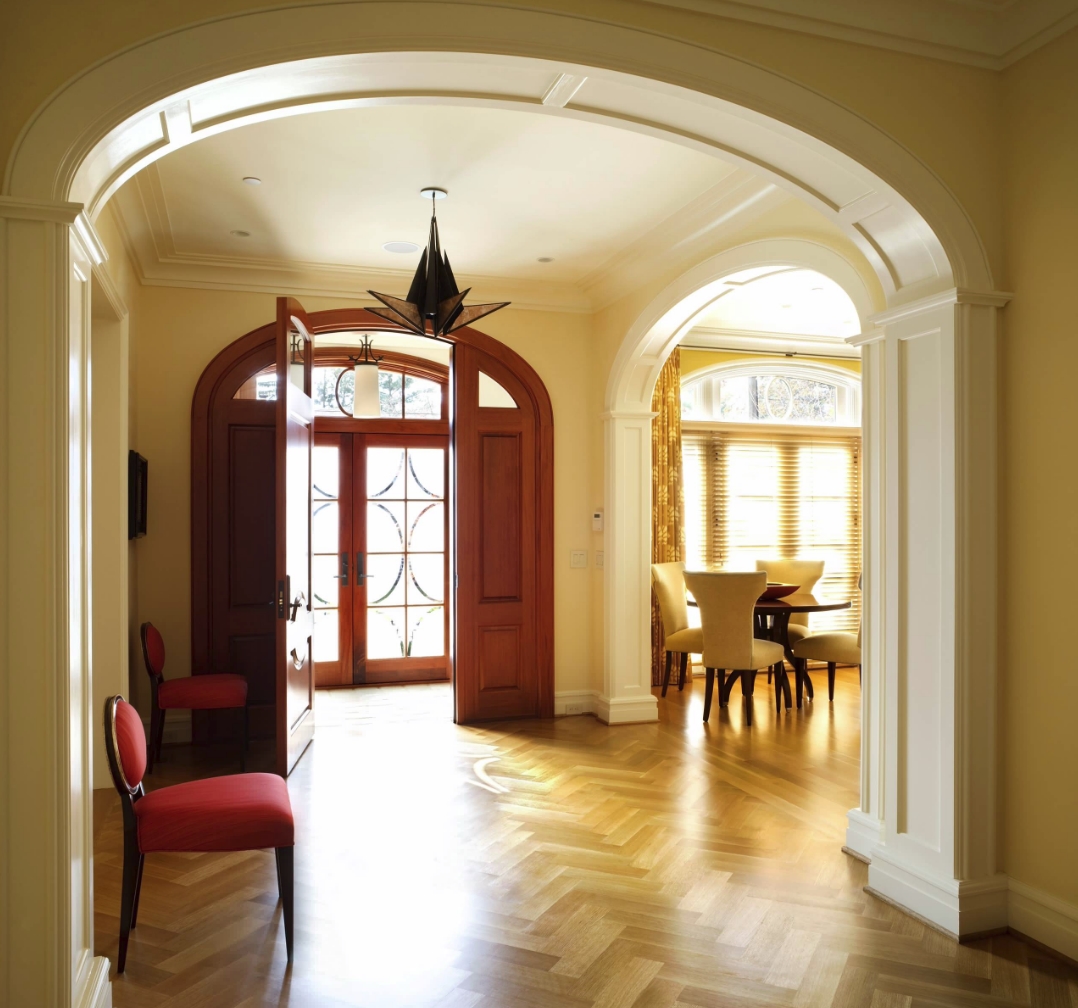 Foyer with red chairs by Sroka Design