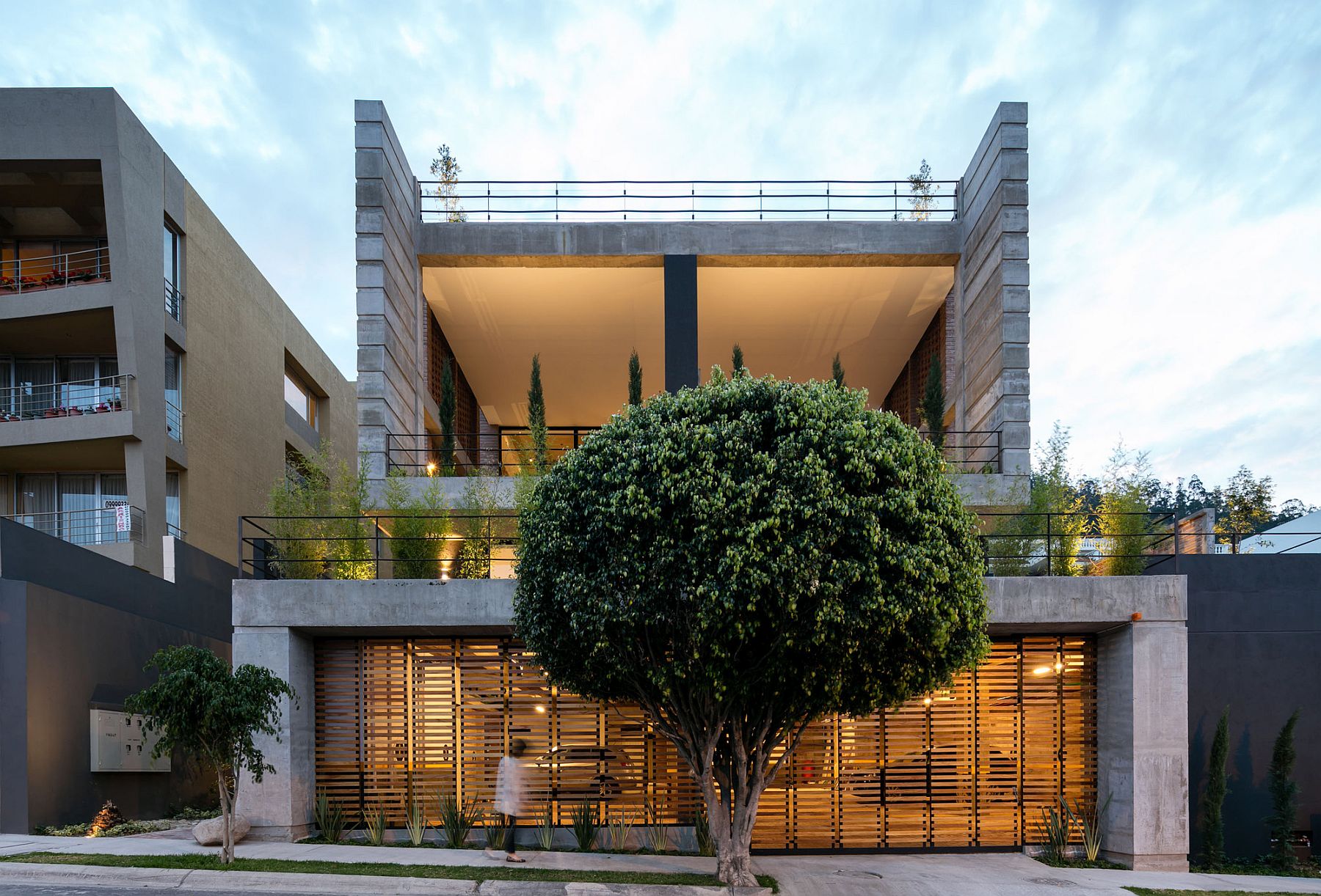 Front facade of teh building combines unabated views with ample privacy