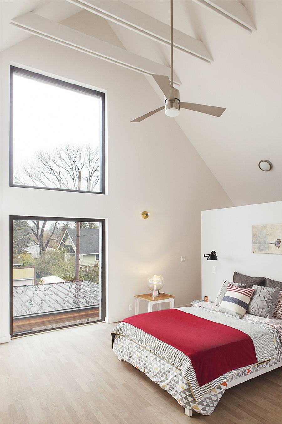 Gabled roof gives the bedroom a high ceiling