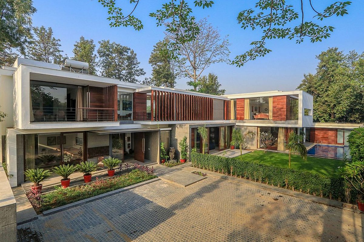 Wooden Slats Glass Walls And Modern Grandeur Gallery House In India