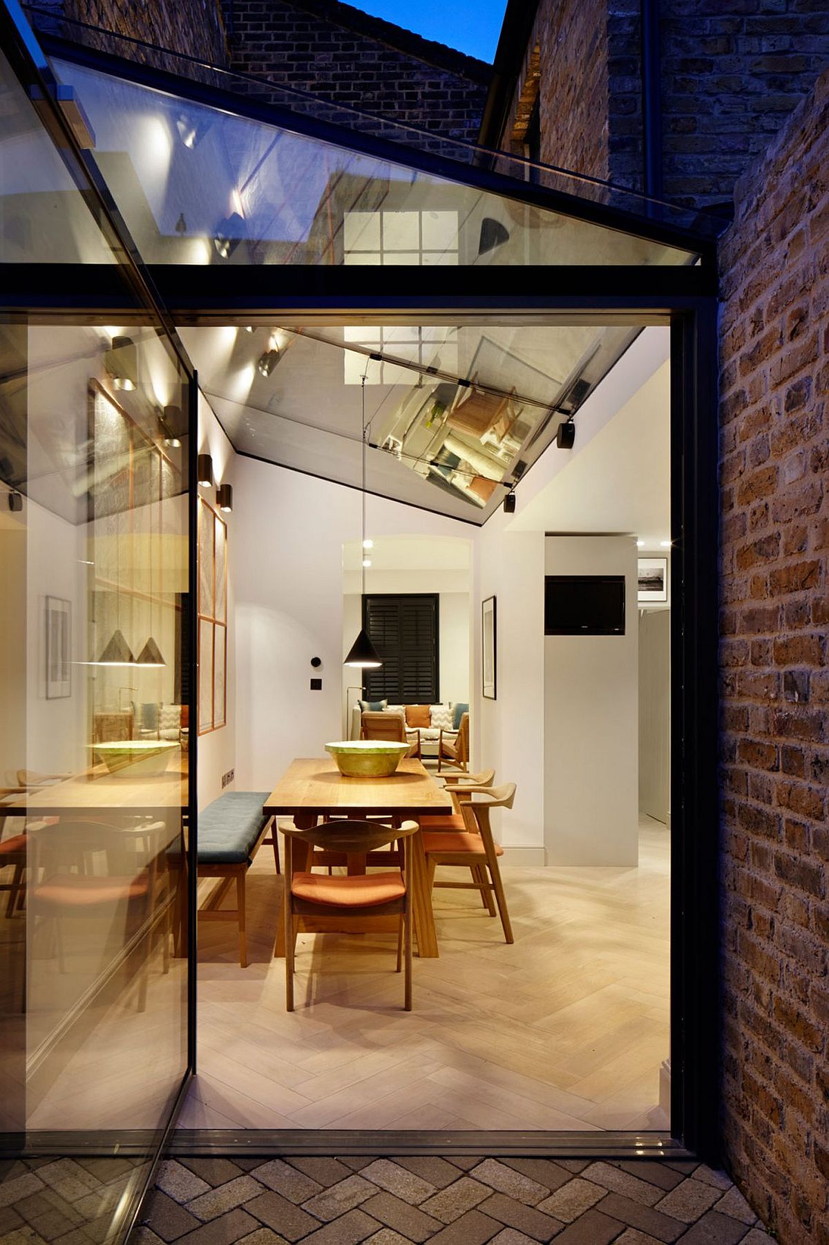 Glass and steel extension of the classic London home in brick