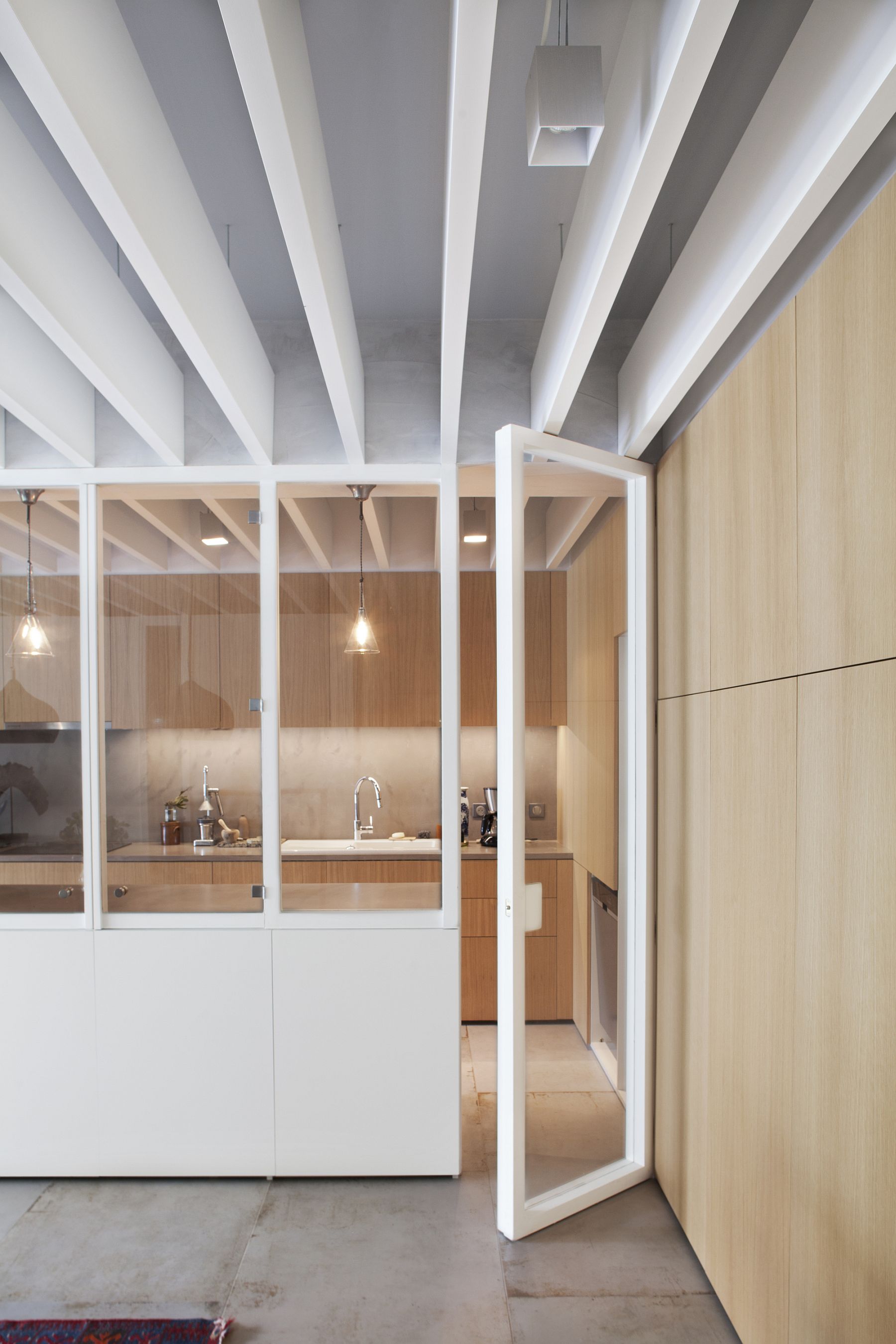 Glass doors and walls allow for unobstructed flow of natural light