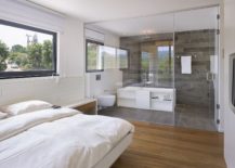 Glass-wall-seperates-the-bedroom-from-the-bathroom-217x155