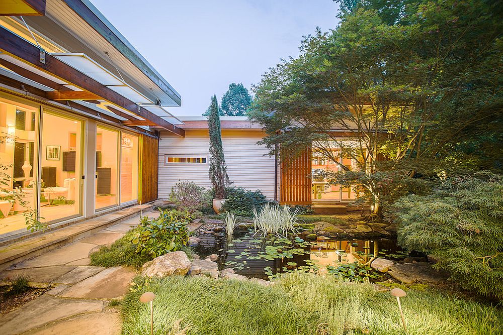 Gorgeous Asian courtyard connected with the living area and the home office [Design: Arielle C. Schechter / Photography: Duffy Healey]