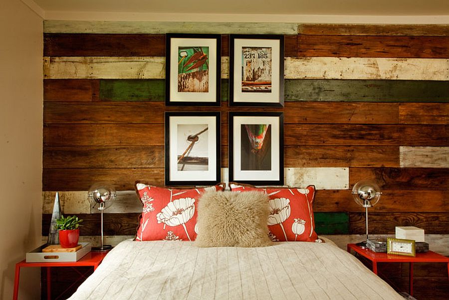 Gorgeous beach style bedroom with a unique reclaimed wood accent wall [Design: Garrison Hullinger Interior Design]