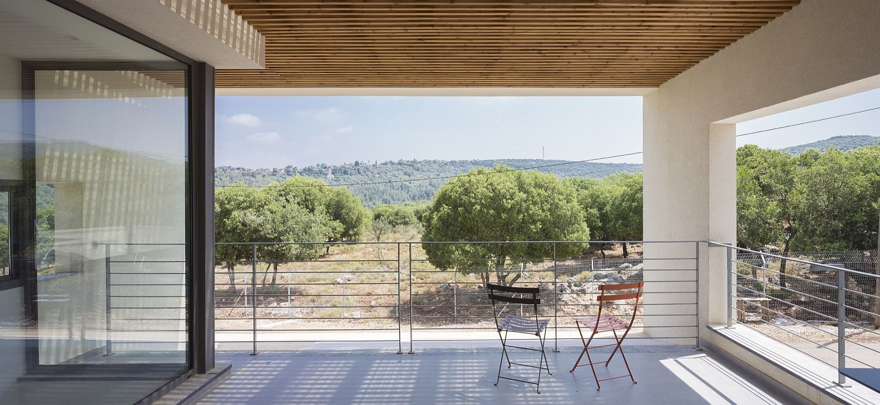 Gorgeous covered deck that overlooks the landscape and beyond