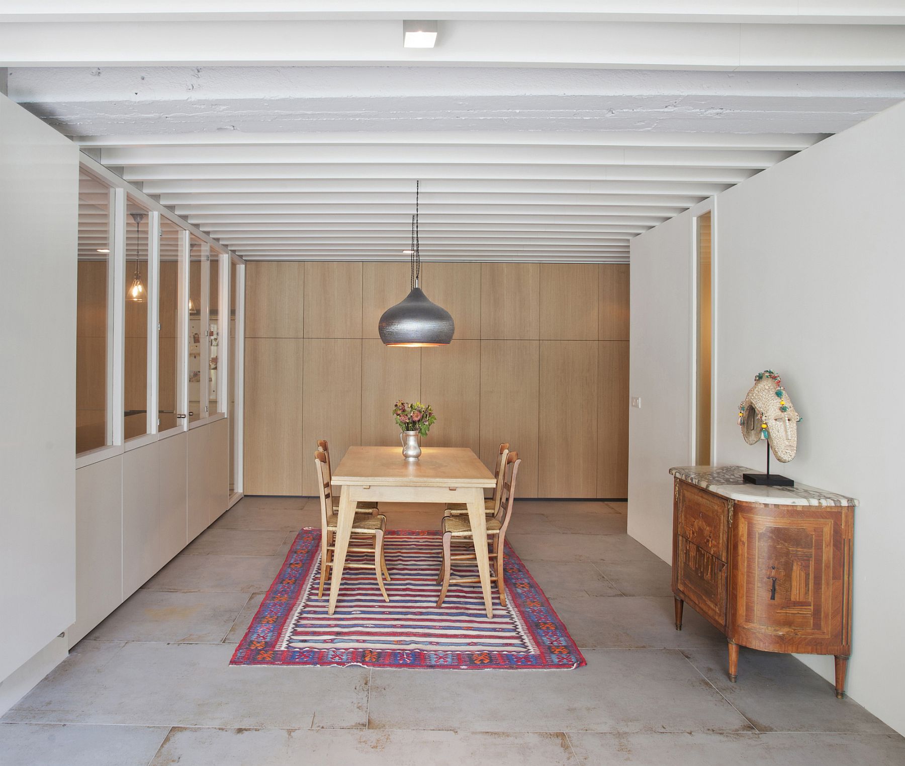 Gorgeous pendant lights steal the show in this elegant dining room