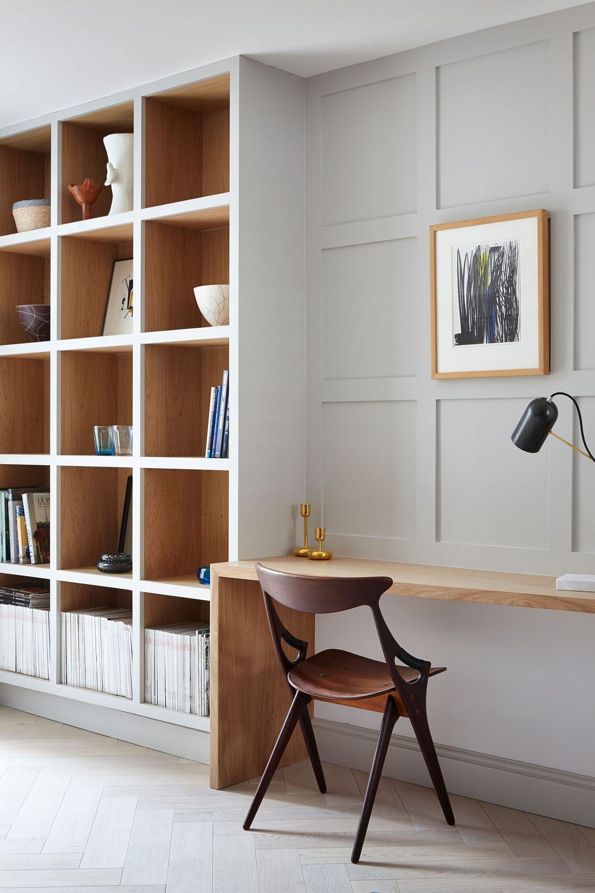 Home workspace and shelving space with sleek wooden desk