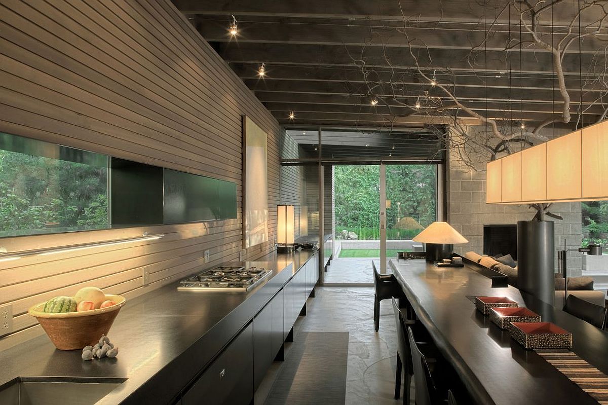 Indoor kitchen station extends outside to create an integration of both the spaces