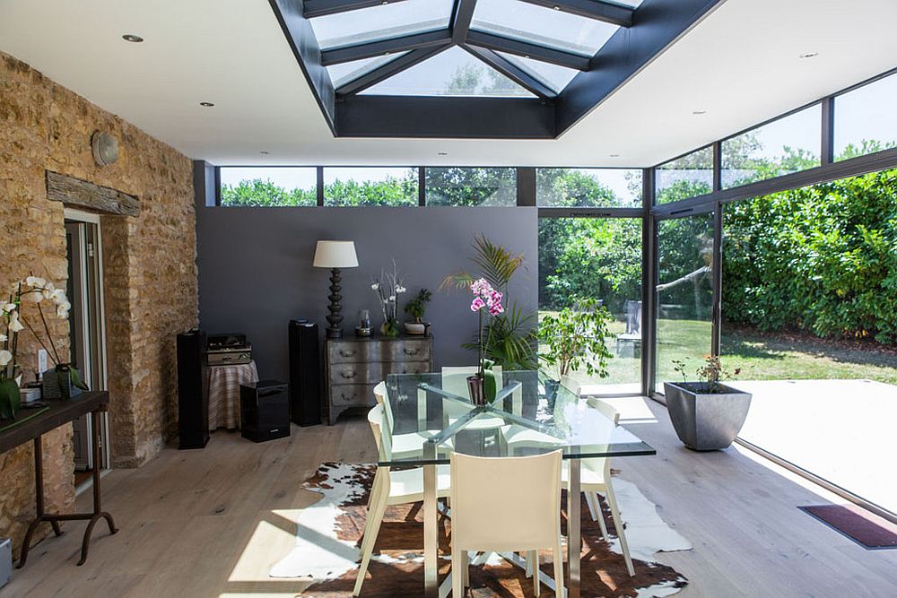 Industrial modern sunroom in gray and white with exposed brick wall