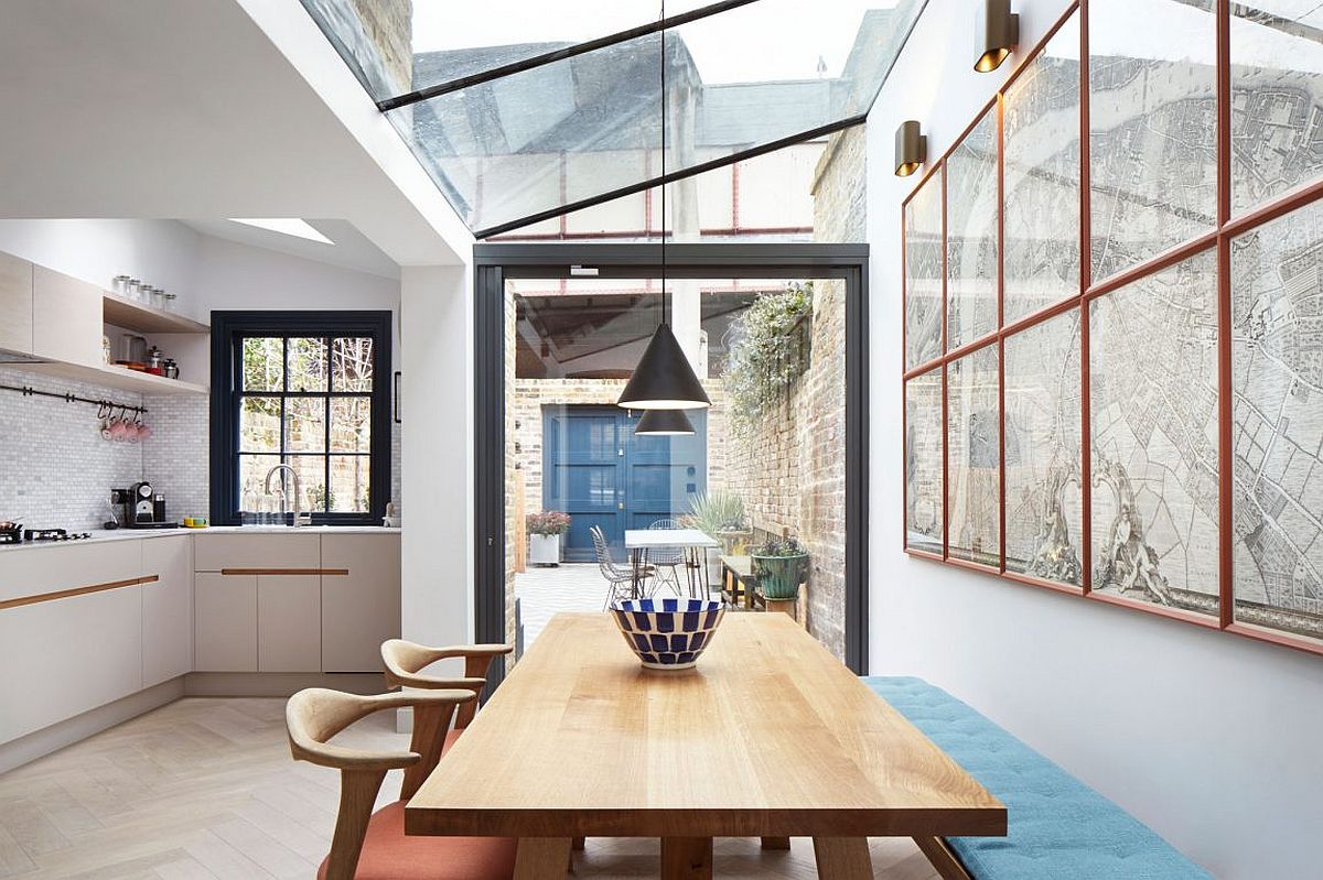Kitchen and dining room of the revamped London home connected with the outdoor lounge