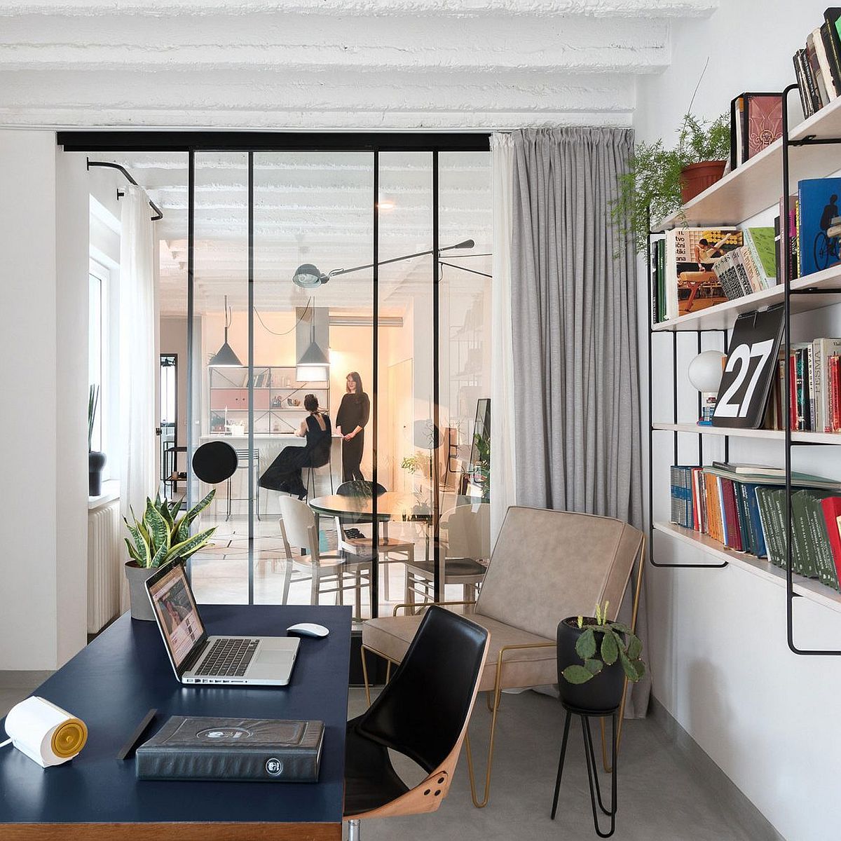 Light-filled and elegant home office with sliding glass doors