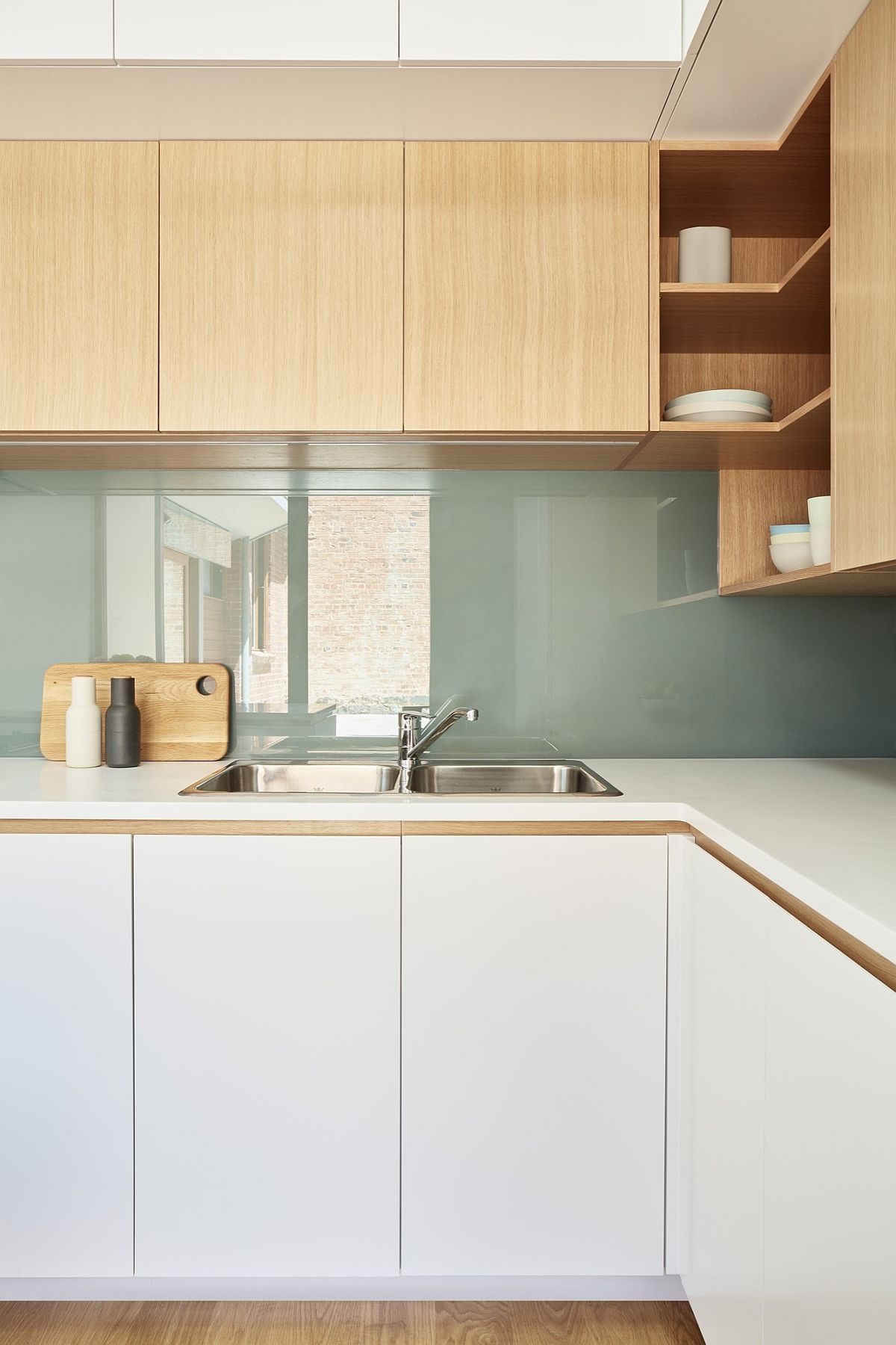 Light-filled revamped kitchen with corner shelving