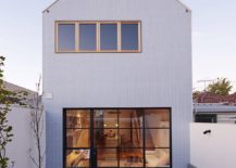 Metal-and-glass-windows-connect-the-interior-with-the-rear-yard-217x155