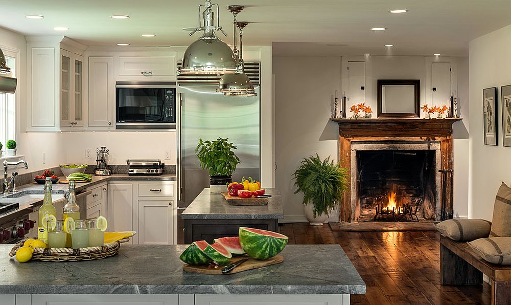 Modern farmhouse kitchen with fireplace in the kitchen [Design: Crisp Architects]