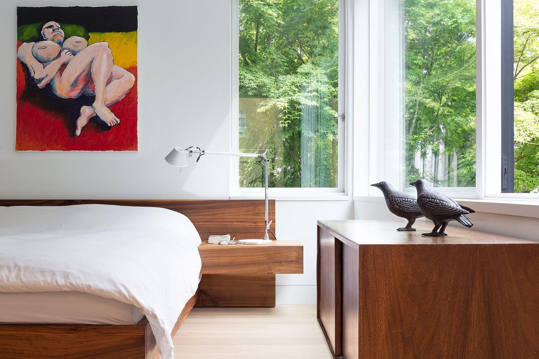 Modern minimal bedroom with platform bed and built-in bedside stands
