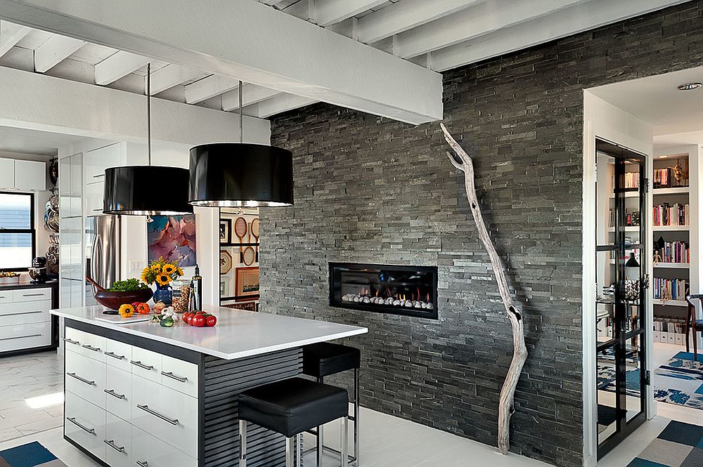 Modern rustic kitchen with fireplace and striking pendant lights