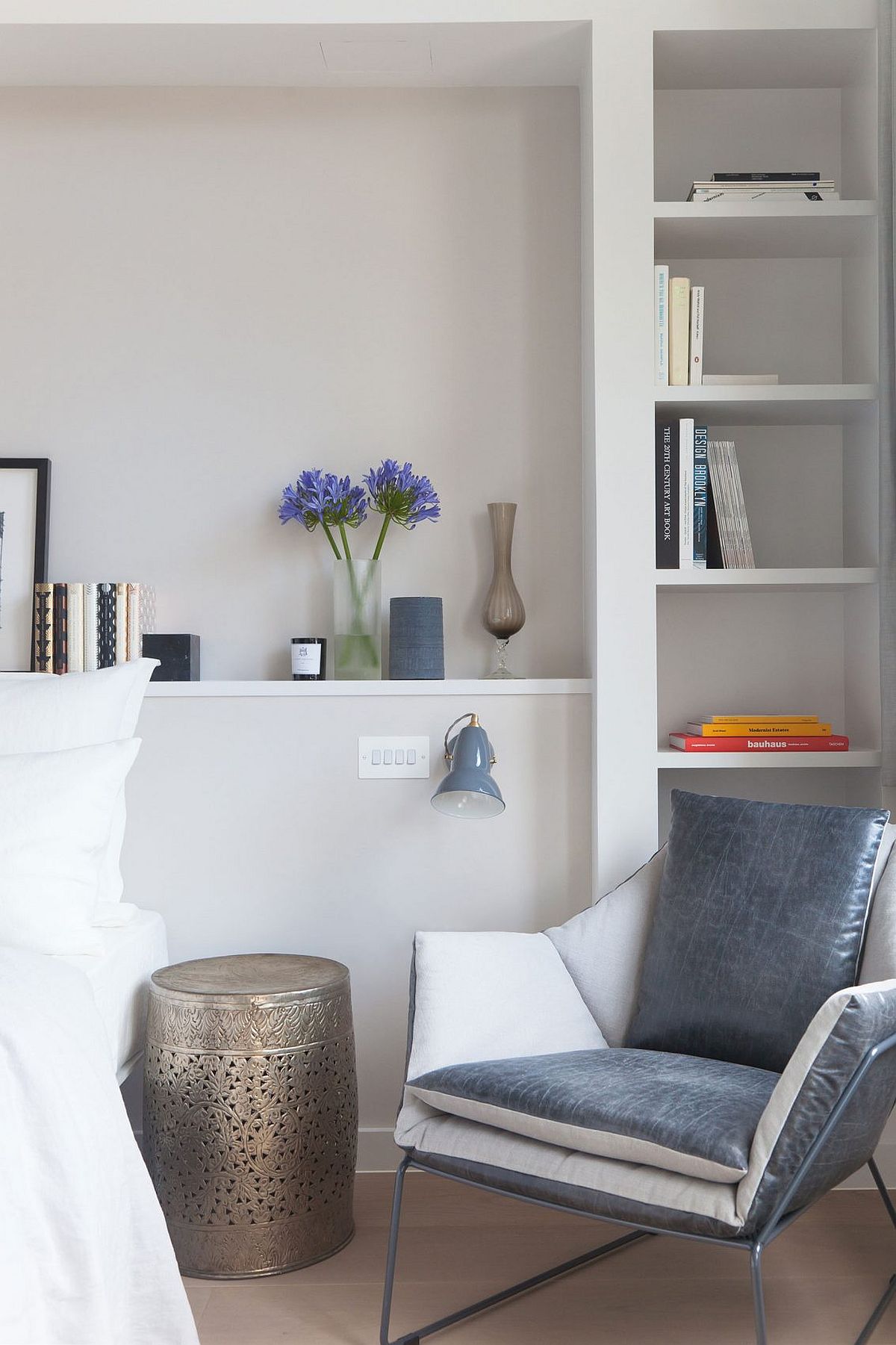 Nightstand adds a silvery touch to the bedroom in white