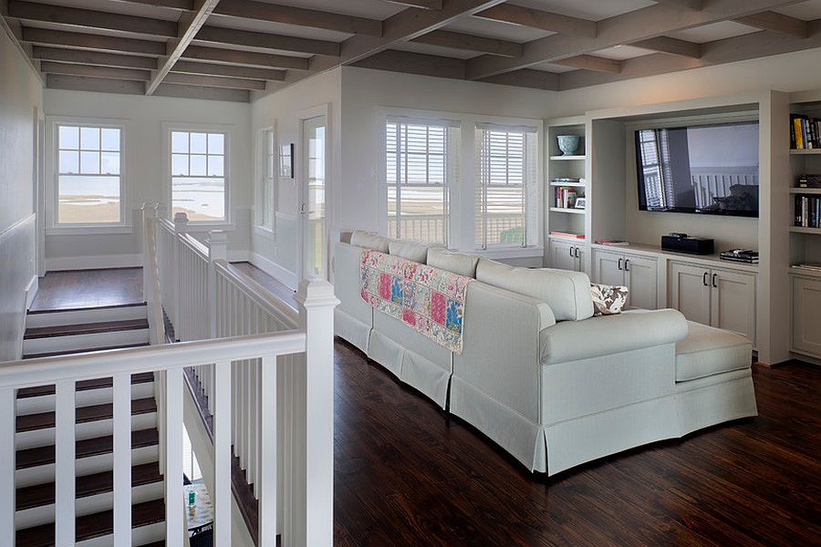 Open home theater with a view of the sand and surf outside [Design: Morningside Architects / Structural Engineers: Palm Coast Structural]