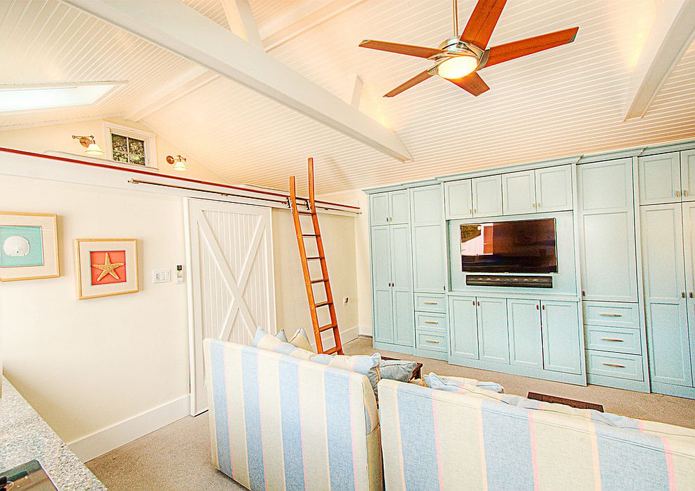 Pastel blues and corals are perfect for the beach style home theater